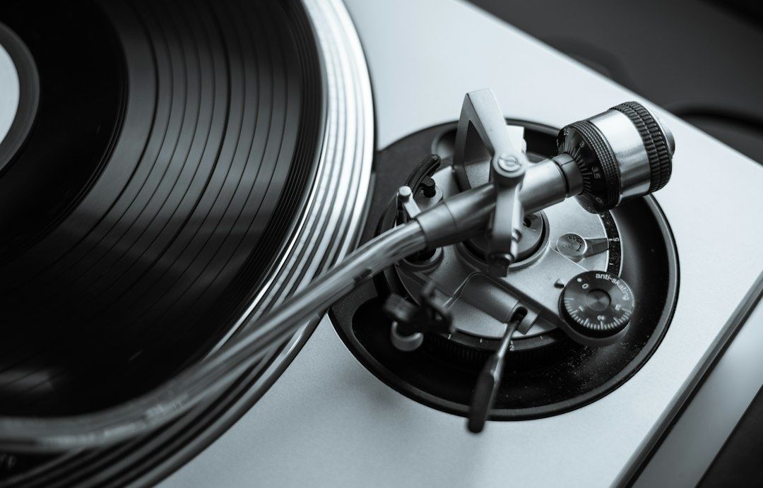 Close-up of a vintage turntable with record and tonearm